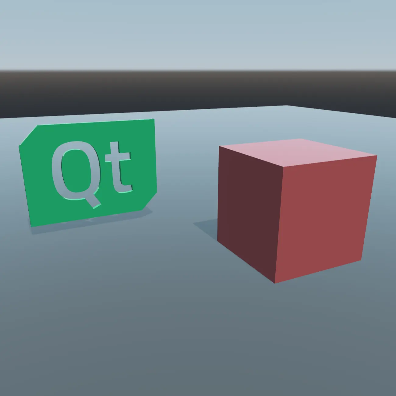 Green Qt logo and red cube on a floor without reflections