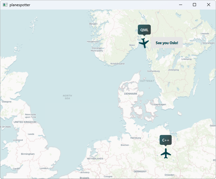 Map of northern Europe with two plane markers labeled "QML" and "C++"