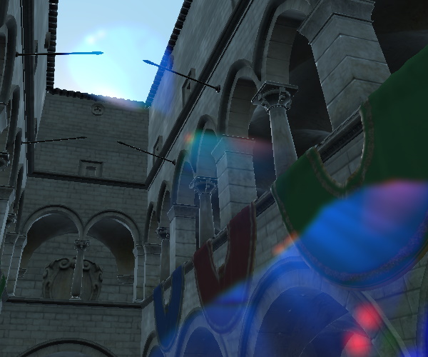 Cour en pierre avec 2 fantômes de lens flare