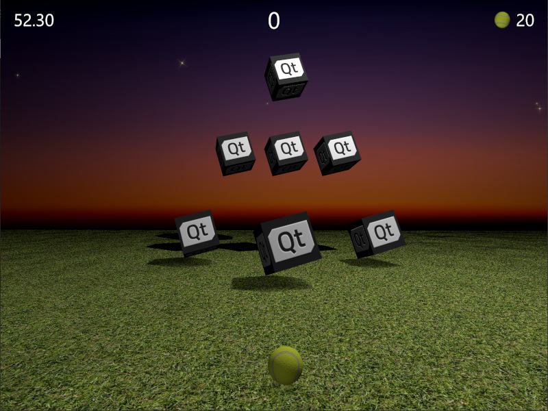 Scène de jeu avec balle et boîtes cibles portant le logo Qt
